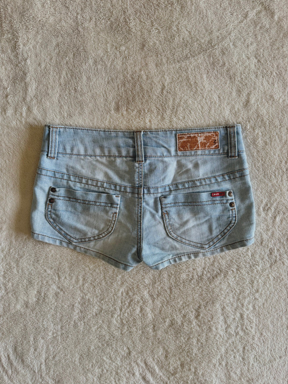y2k vintage low waisted light was denim micro mini shorts with buckles