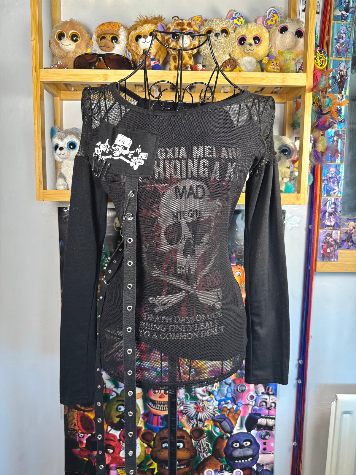 y2k vintage graphic skull print long sleeved top with sheer panels and grommet tassels emo