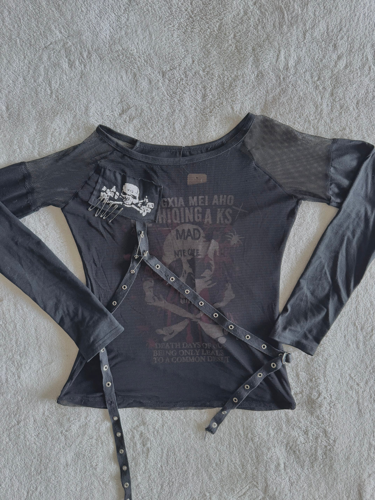 y2k vintage graphic skull print long sleeved top with sheer panels and grommet tassels emo
