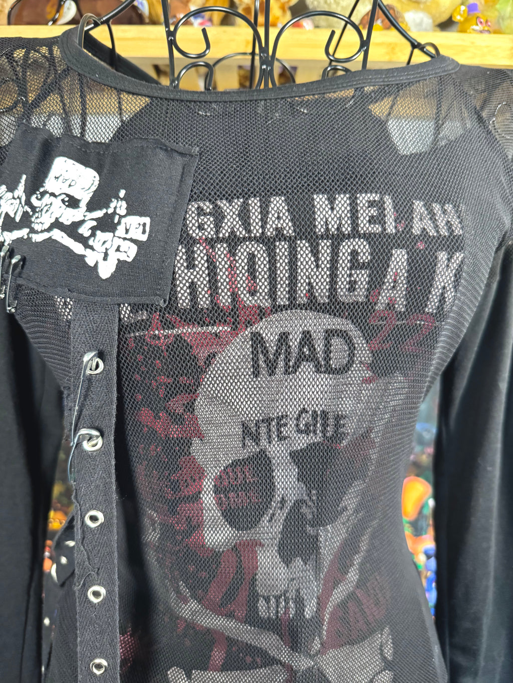 y2k vintage graphic skull print long sleeved top with sheer panels and grommet tassels emo