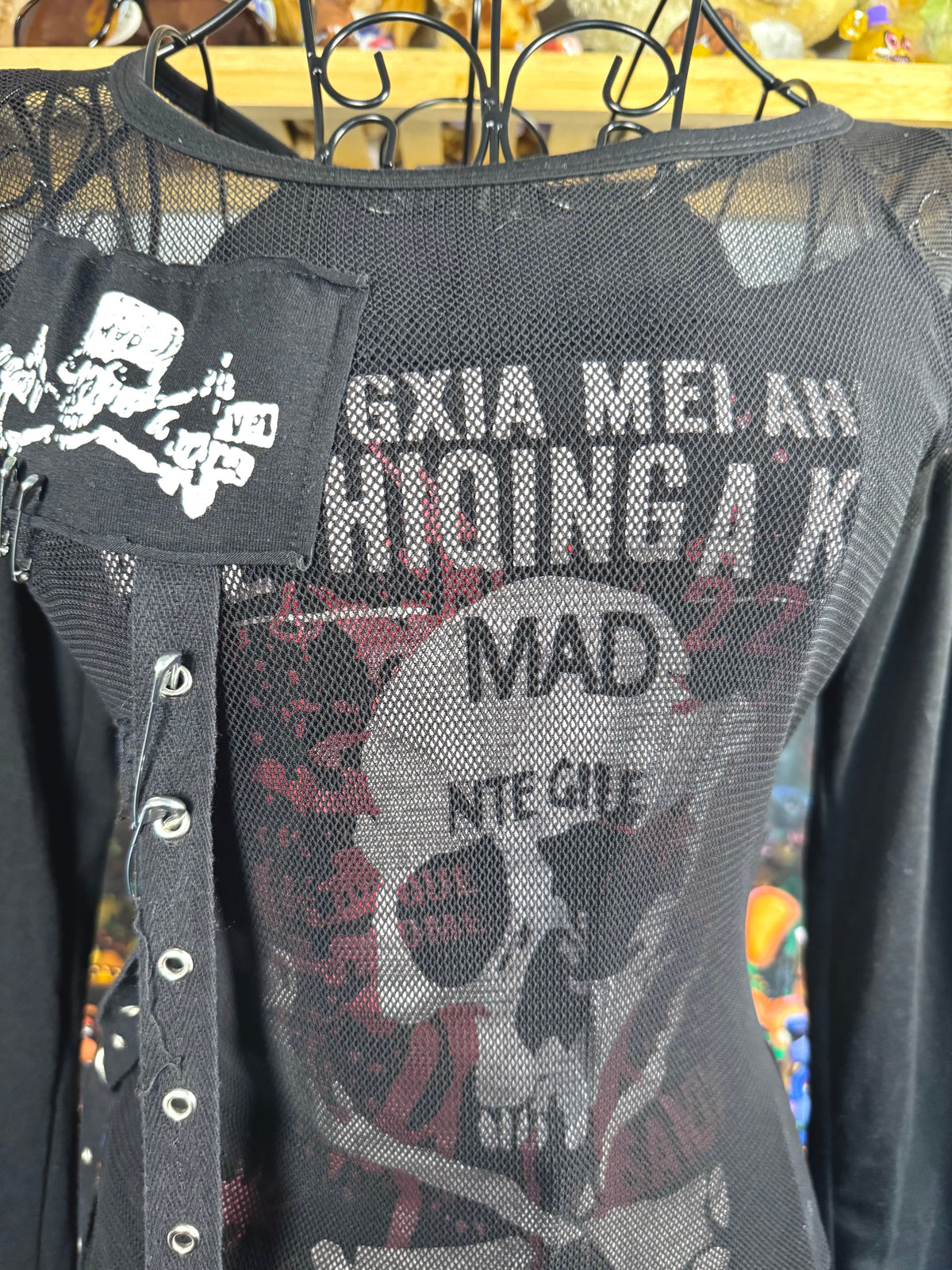 y2k vintage graphic skull print long sleeved top with sheer panels and grommet tassels emo