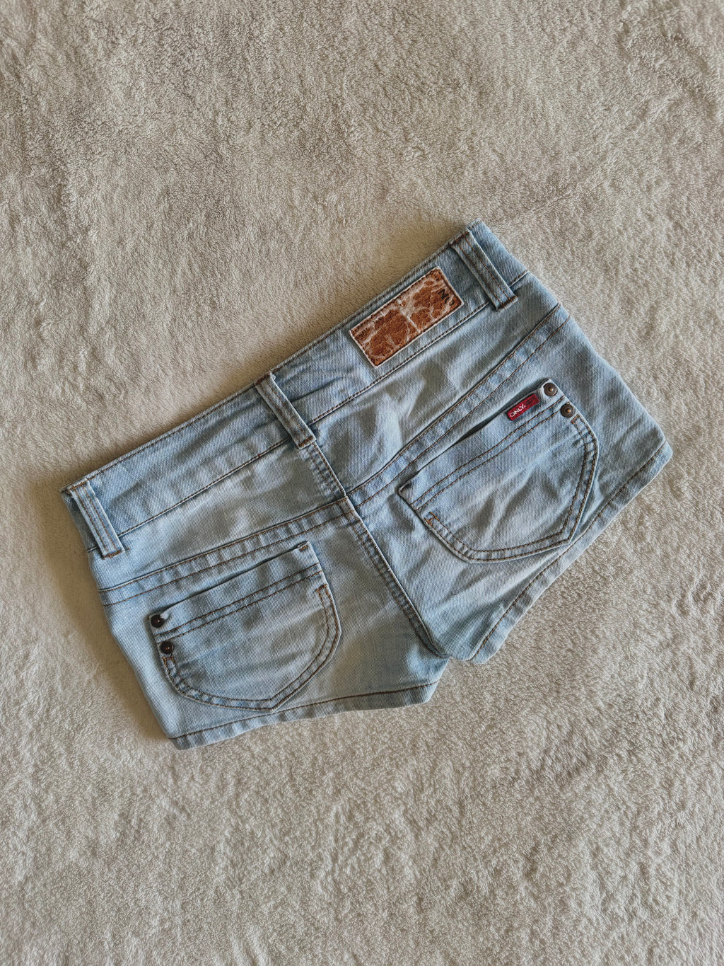 y2k vintage low waisted light was denim micro mini shorts with buckles