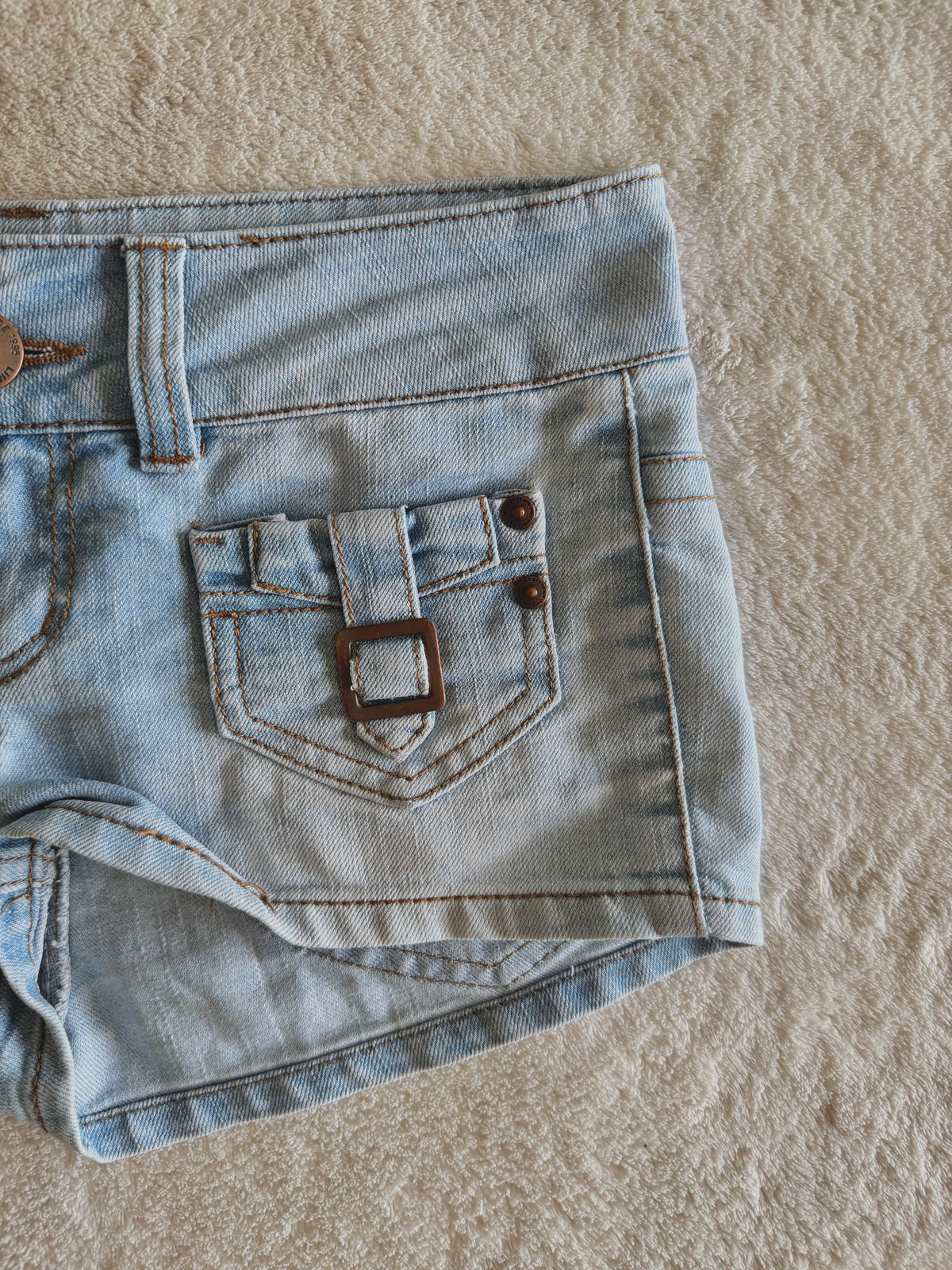 y2k vintage low waisted light was denim micro mini shorts with buckles