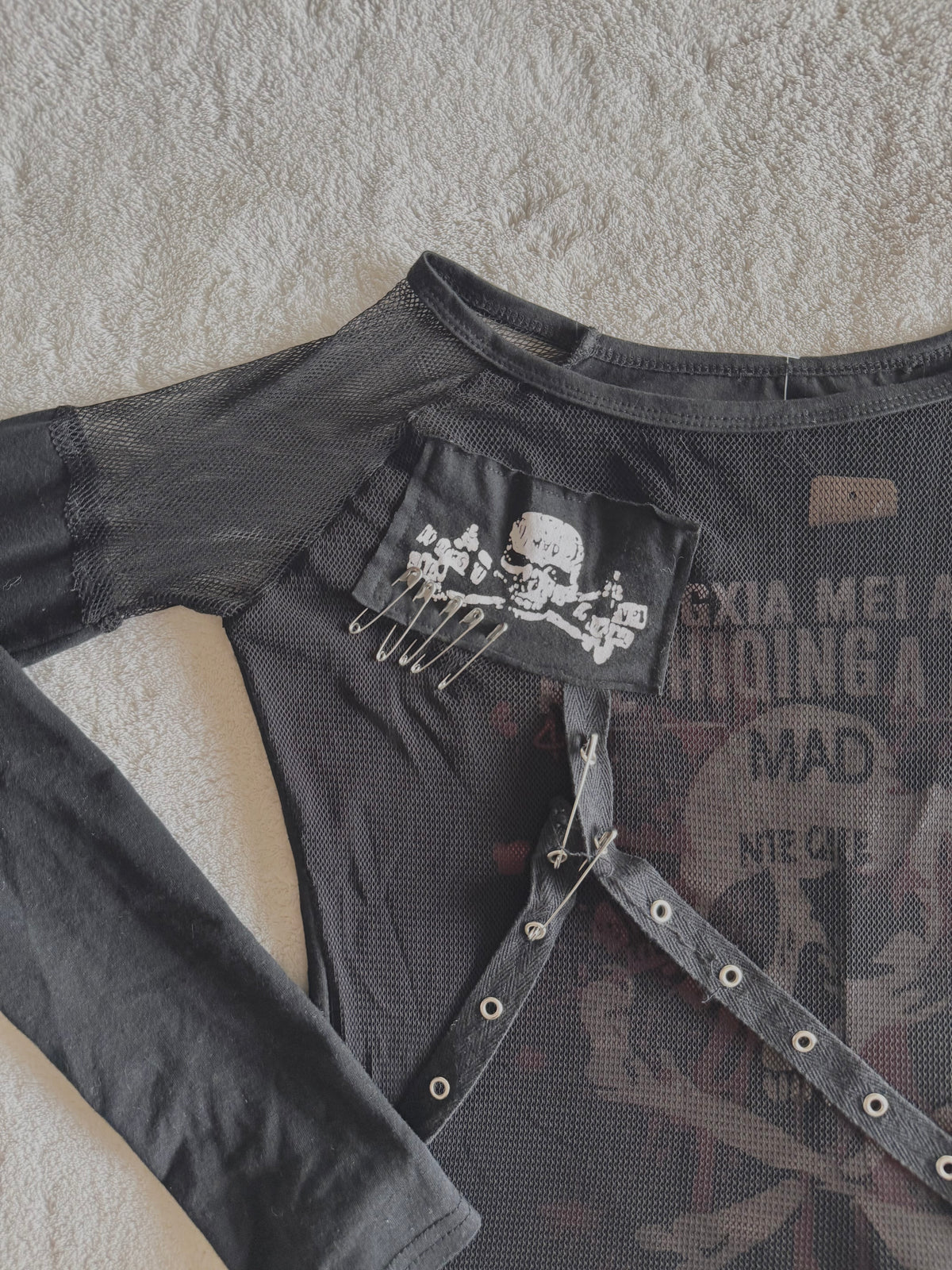 y2k vintage graphic skull print long sleeved top with sheer panels and grommet tassels emo