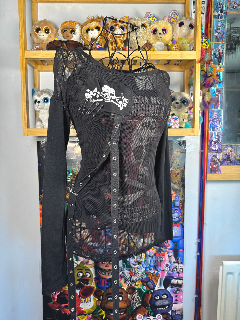 y2k vintage graphic skull print long sleeved top with sheer panels and grommet tassels emo