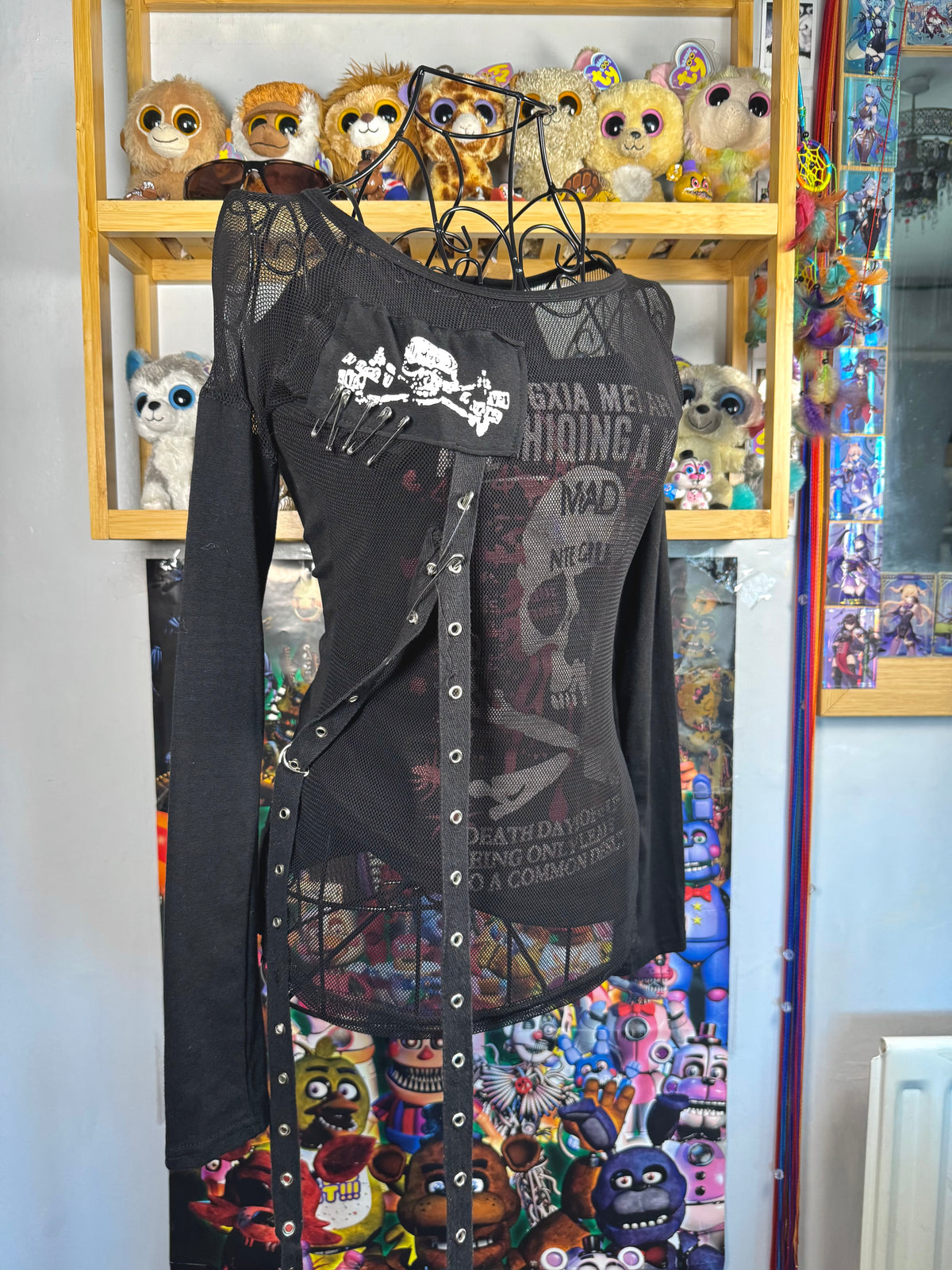 y2k vintage graphic skull print long sleeved top with sheer panels and grommet tassels emo