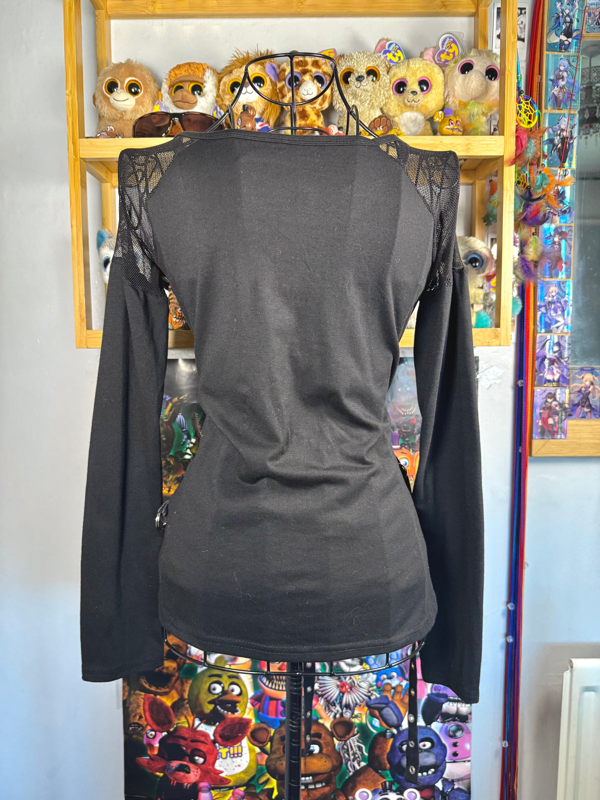 y2k vintage graphic skull print long sleeved top with sheer panels and grommet tassels emo
