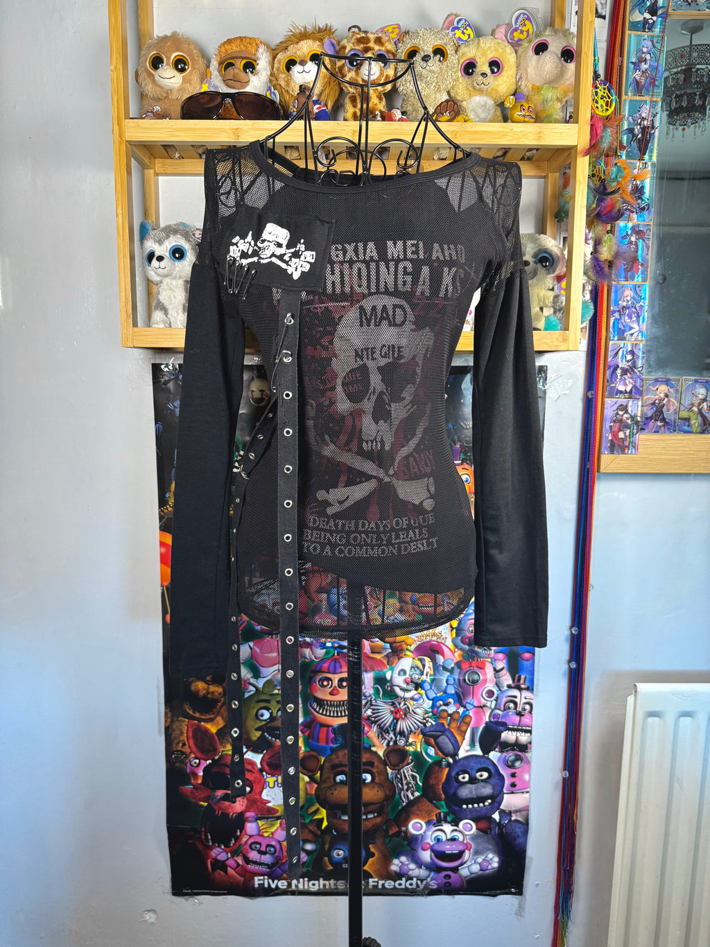 y2k vintage graphic skull print long sleeved top with sheer panels and grommet tassels emo