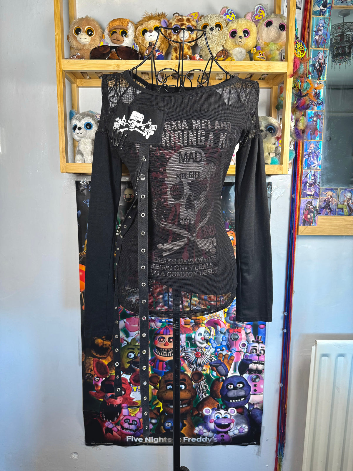 y2k vintage graphic skull print long sleeved top with sheer panels and grommet tassels emo